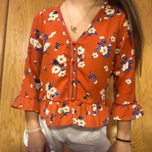 burnt orange floral blouse